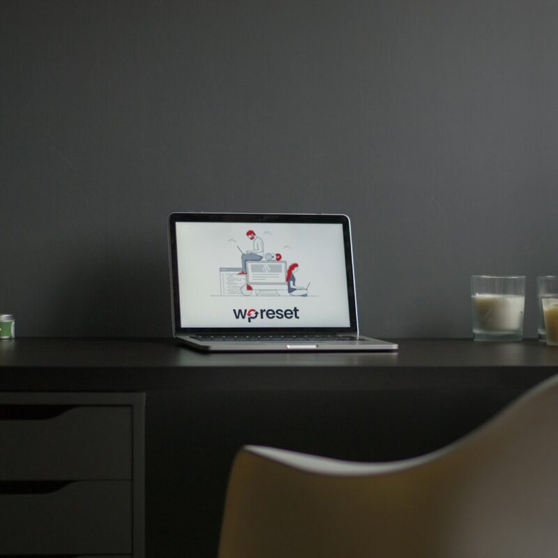 macbook air on black wooden desk